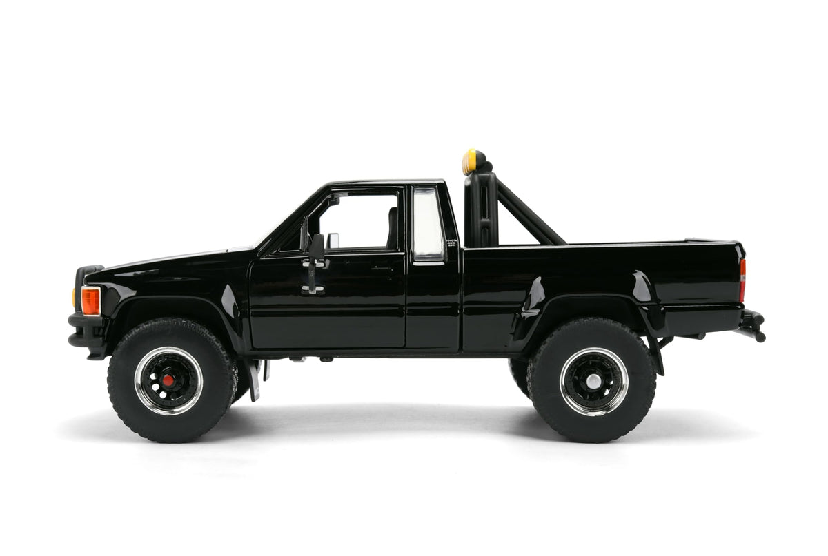 Back to the Future 1985 Toyota SR5 Pickup Truck with Skateboard - 1:24 Hollywood Rides Diecast Model with Opening Doors and Hood - Black - for Collectors and Enthusiasts 8+