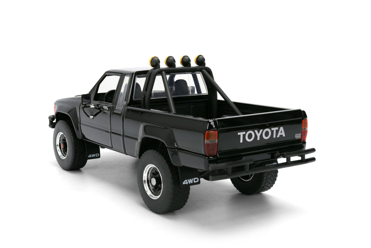 Back to the Future 1985 Toyota SR5 Pickup Truck with Skateboard - 1:24 Hollywood Rides Diecast Model with Opening Doors and Hood - Black - for Collectors and Enthusiasts 8+