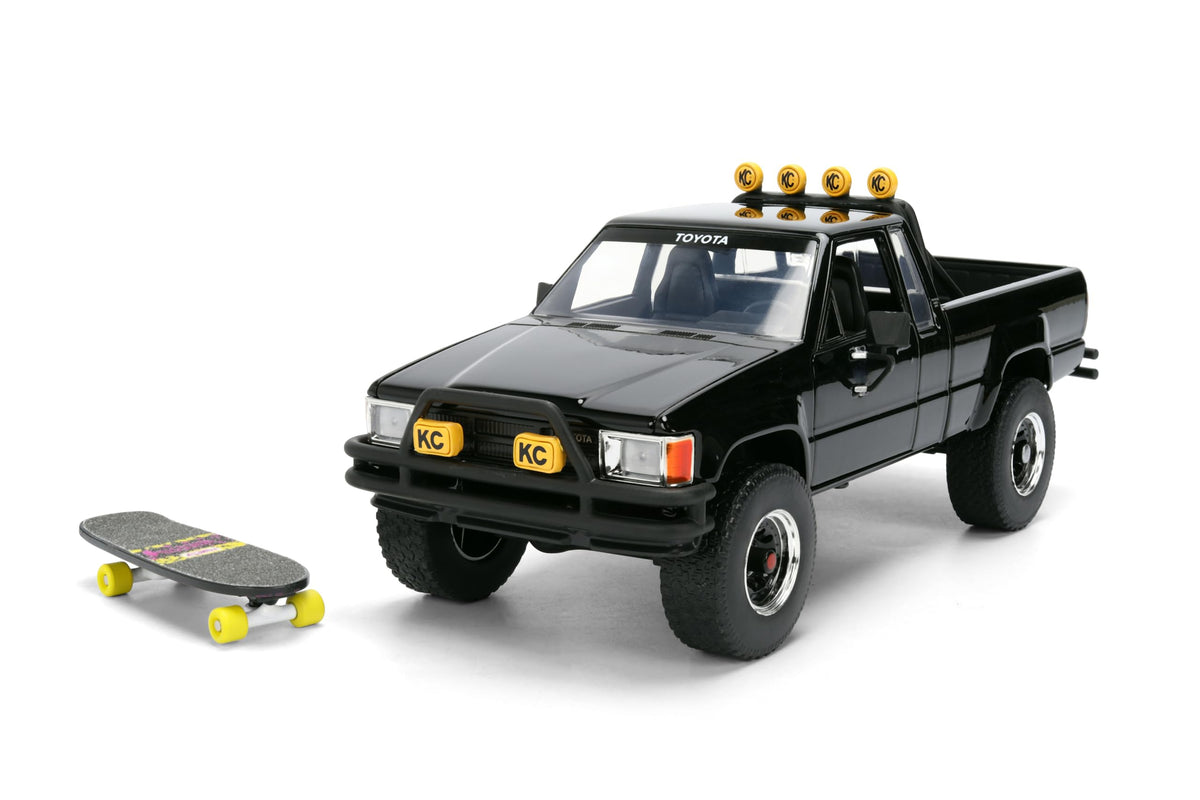 Back to the Future 1985 Toyota SR5 Pickup Truck with Skateboard - 1:24 Hollywood Rides Diecast Model with Opening Doors and Hood - Black - for Collectors and Enthusiasts 8+