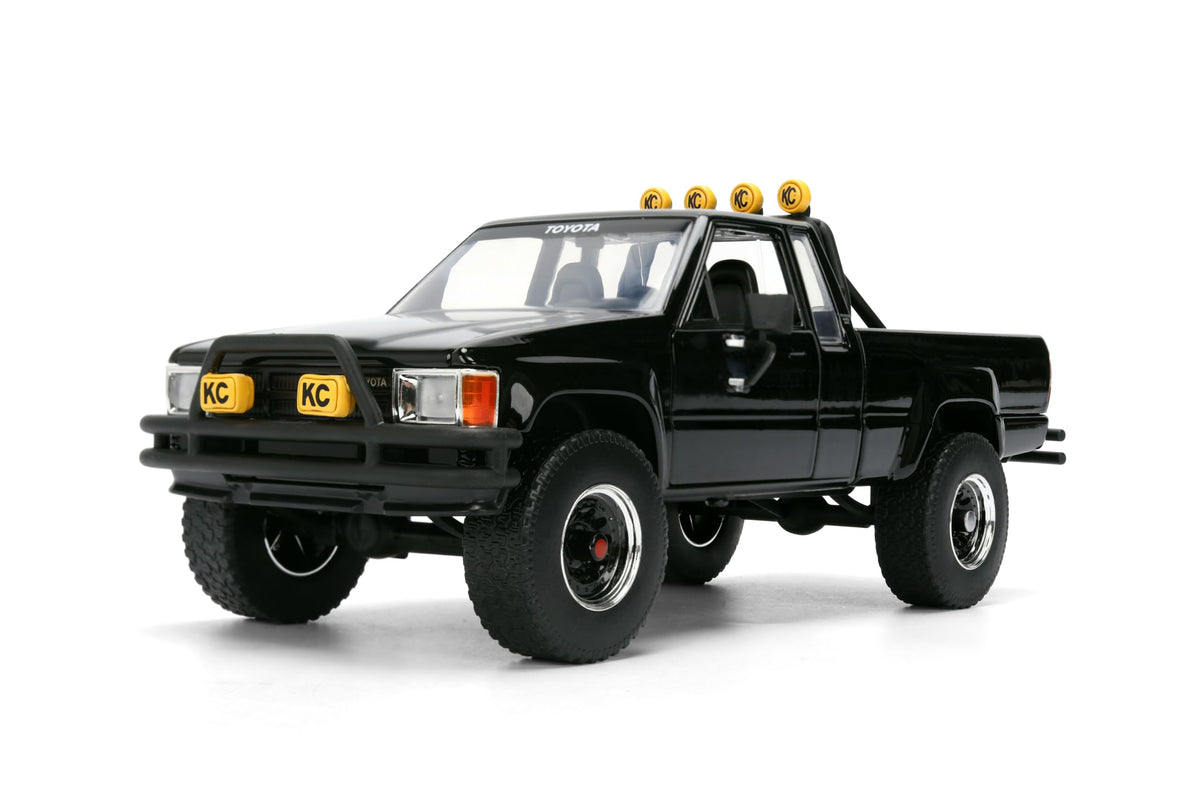 Back to the Future 1985 Toyota SR5 Pickup Truck with Skateboard - 1:24 Hollywood Rides Diecast Model with Opening Doors and Hood - Black - for Collectors and Enthusiasts 8+